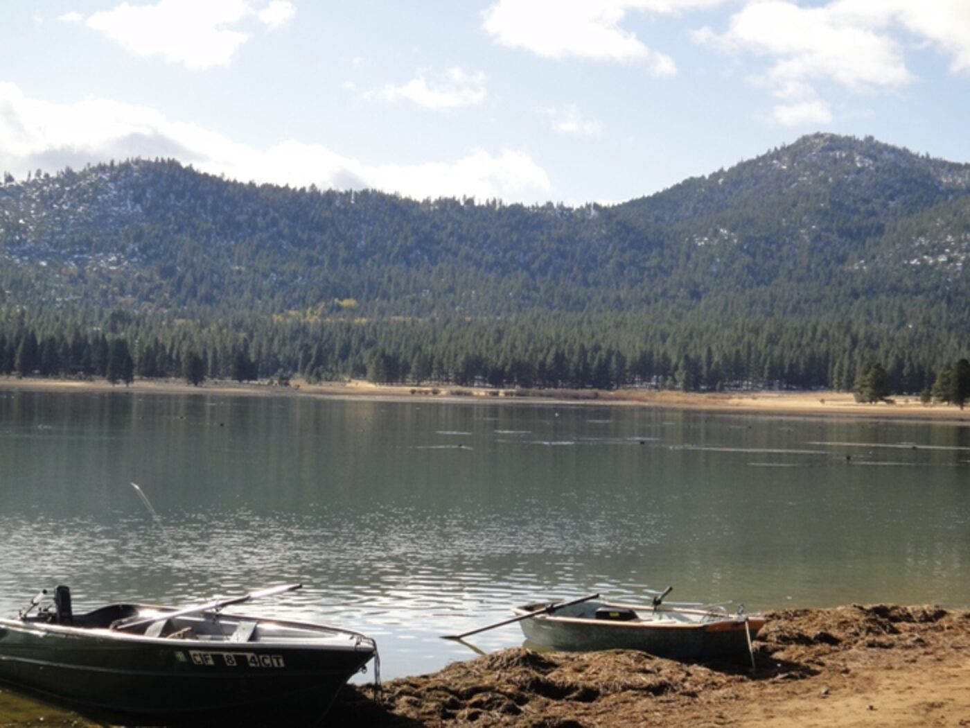 Two boats resting on the shoreline ready to get back on the water